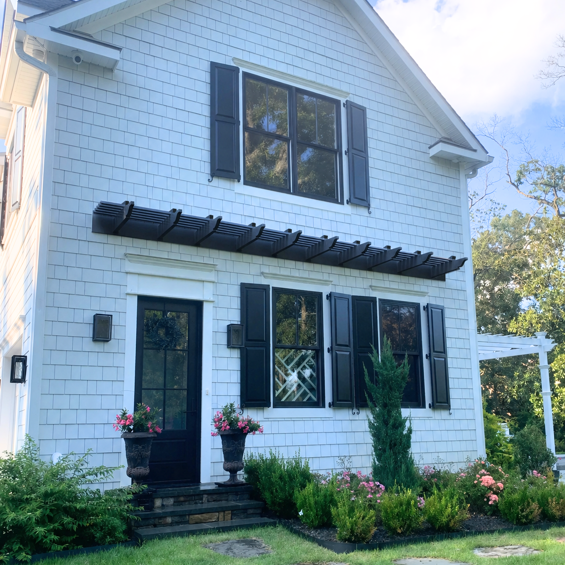 black pergola with heavy-duty aluminum-reinforced construction