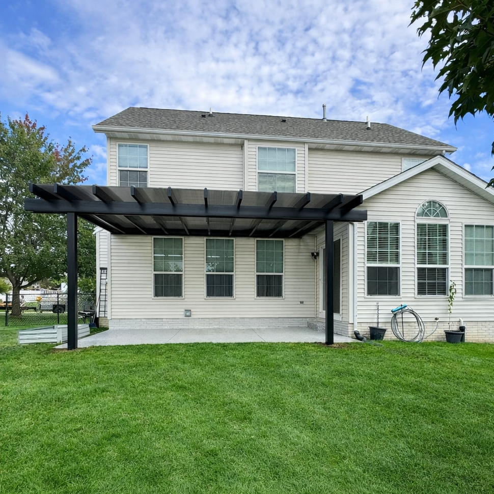 rainproof covered pergola beside a swimming pool patio