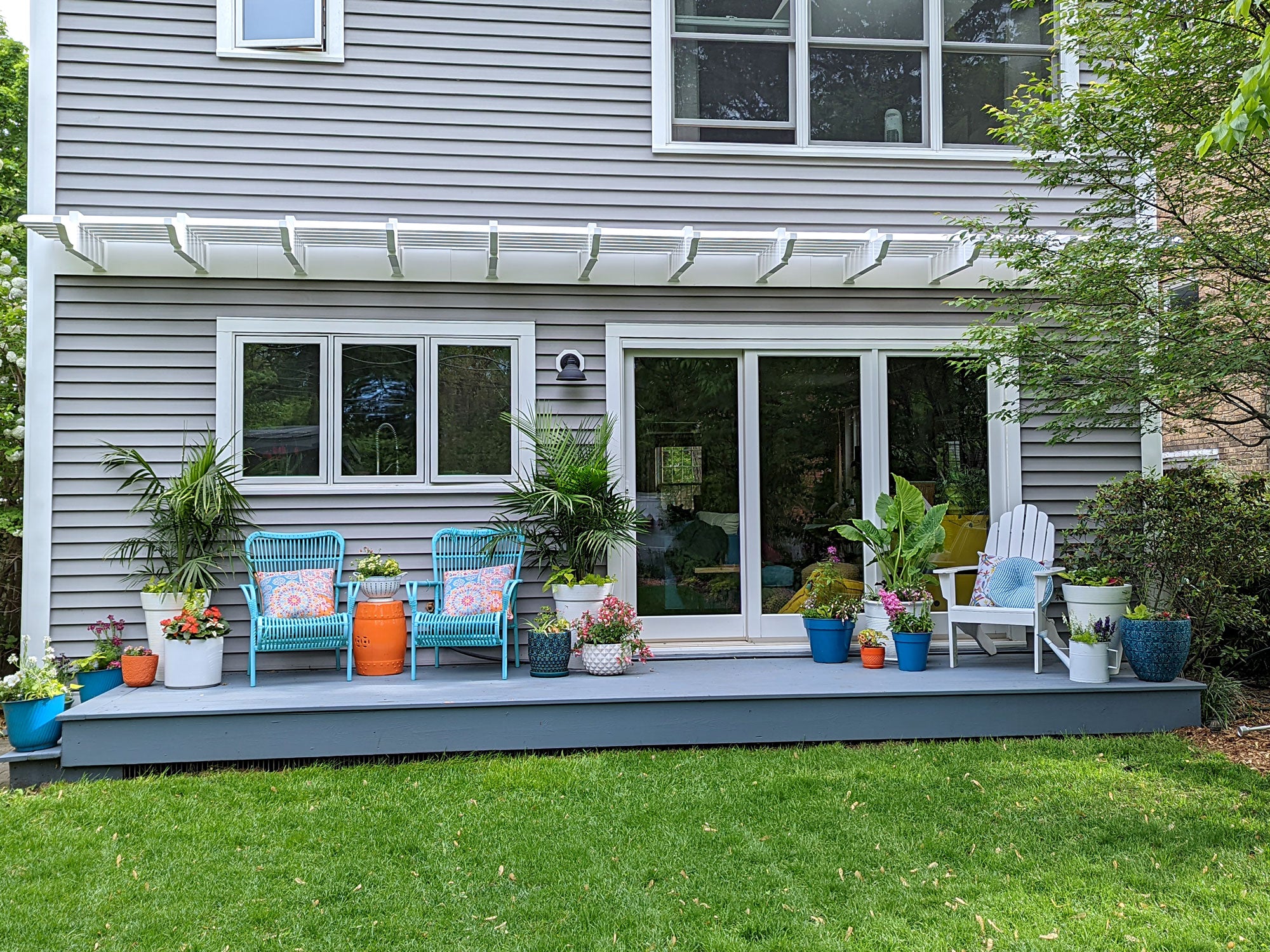 Decorative attached eyebrow pergola used as an architectural accent