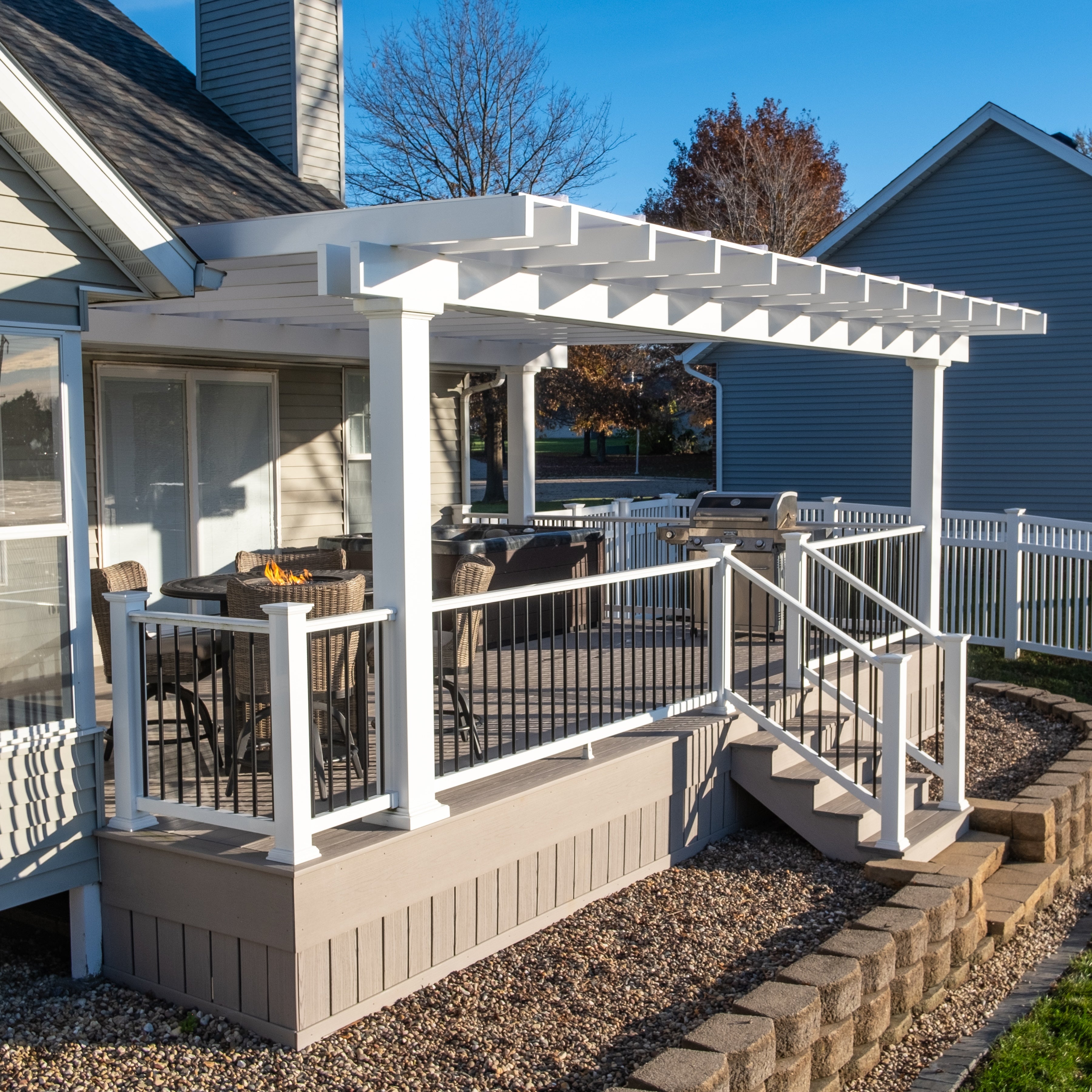Freestanding solid-roof patio cover providing covered outdoor space