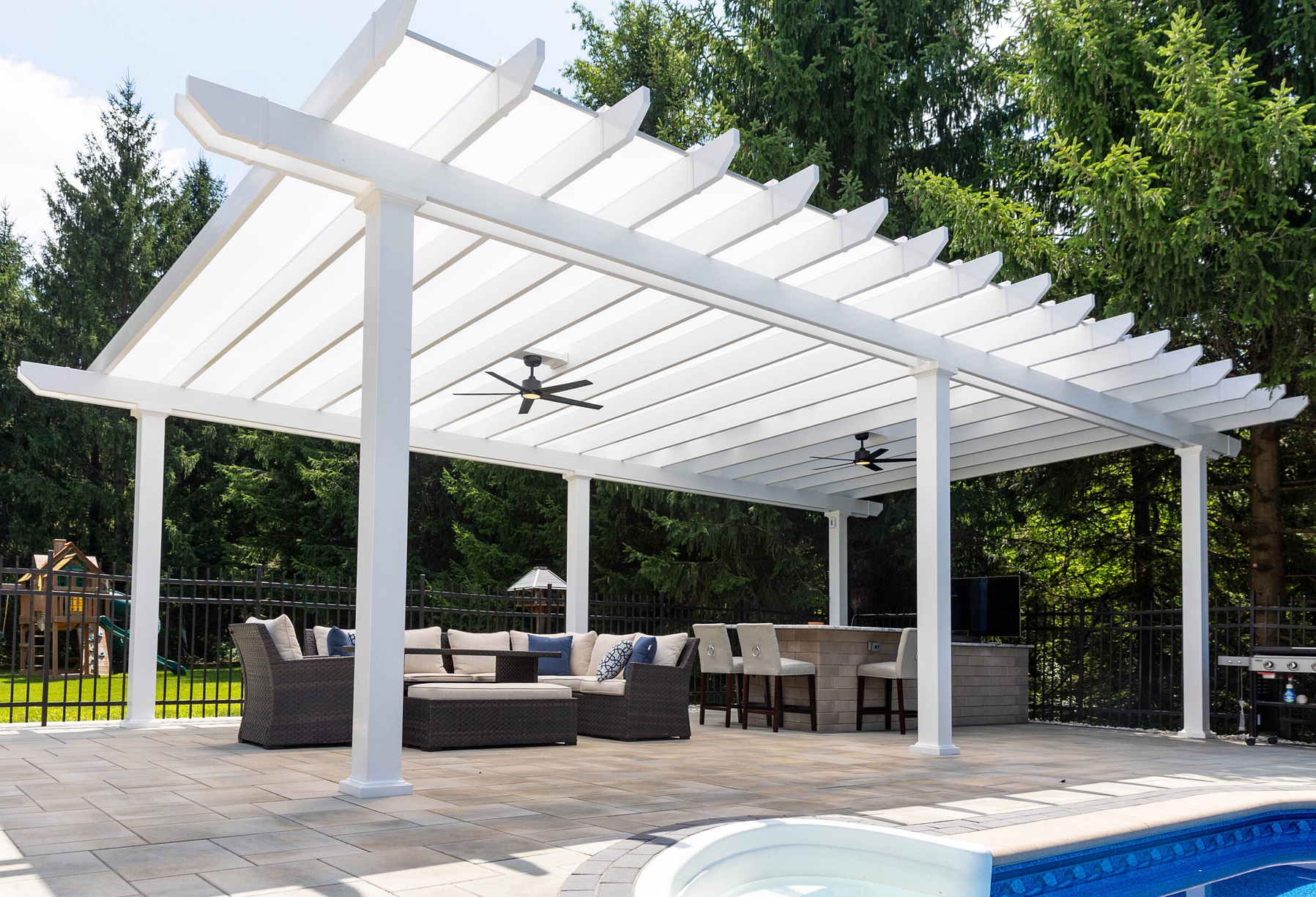 Large freestanding white patio cover with solid polycarbonate roofing