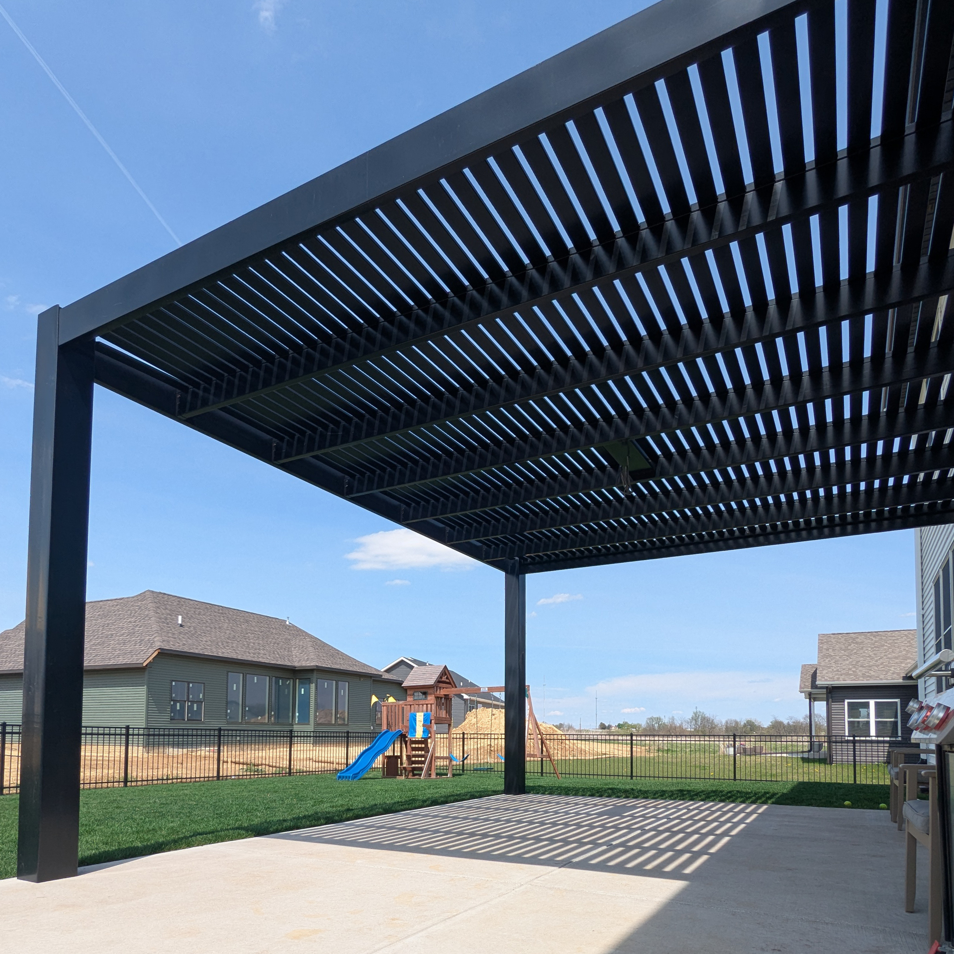 modern attached pergola with two-post configuration