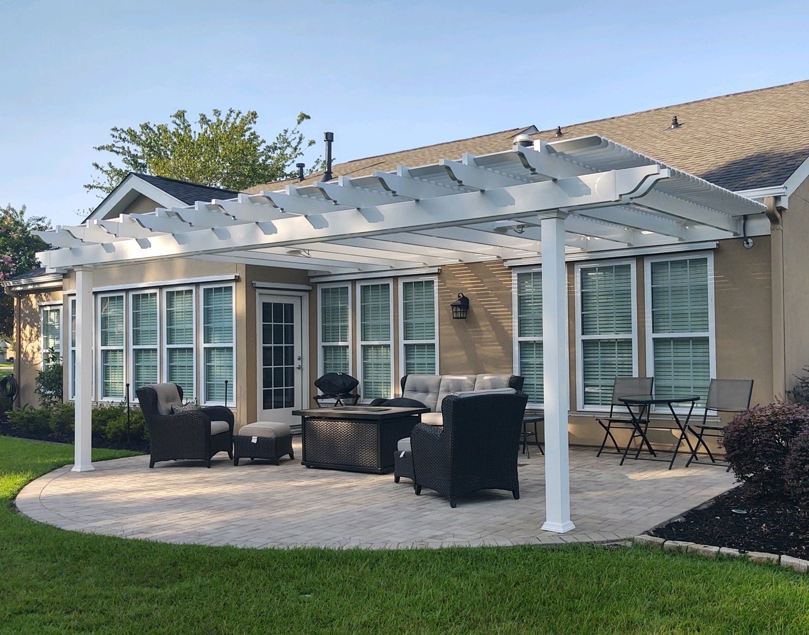 Pergola with roof attached to house in traditional style
