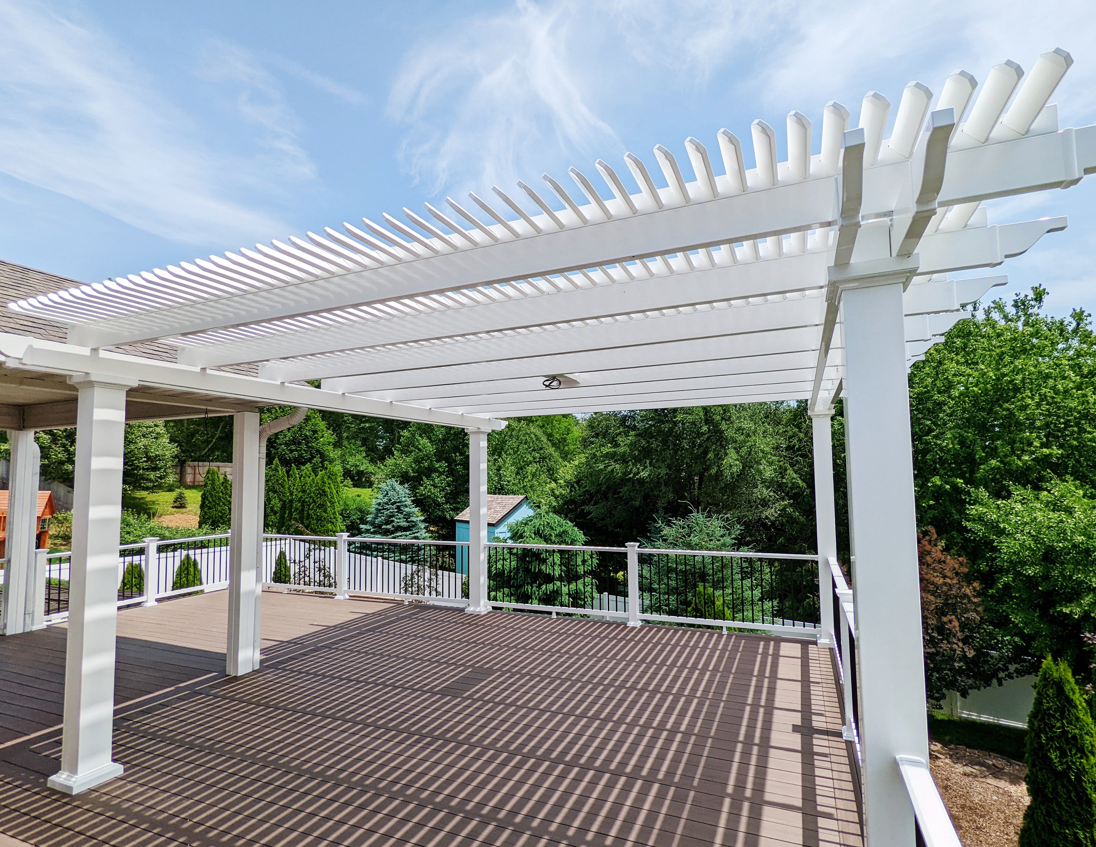 permanent customizable pergola installed over an outdoor living space