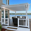 White 4-post traditional pergola with overhangs providing shade for patio furniture near a house with a beautiful river in the background